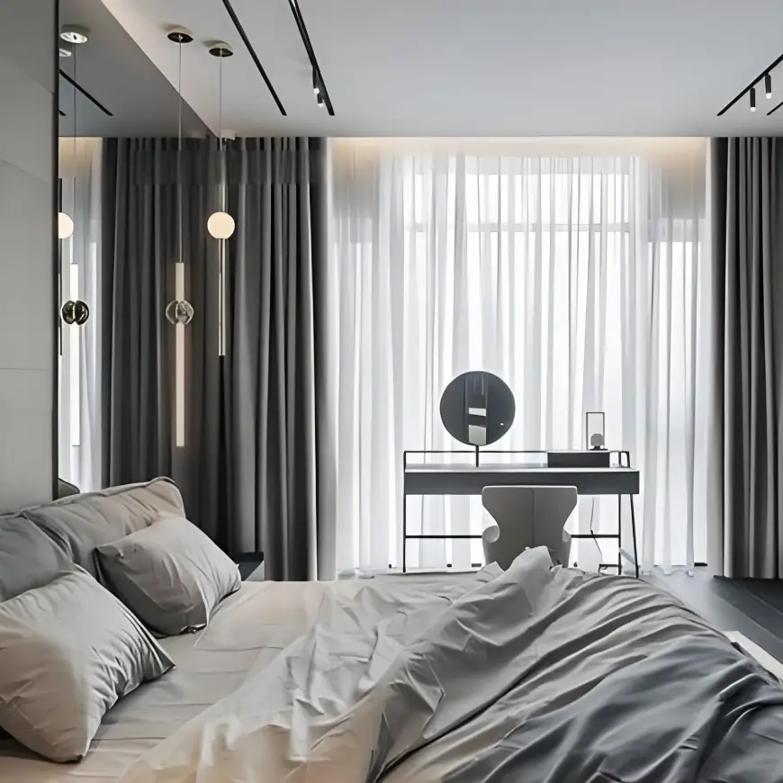 Layered sheer and blackout-style curtains installed across a bedroom window