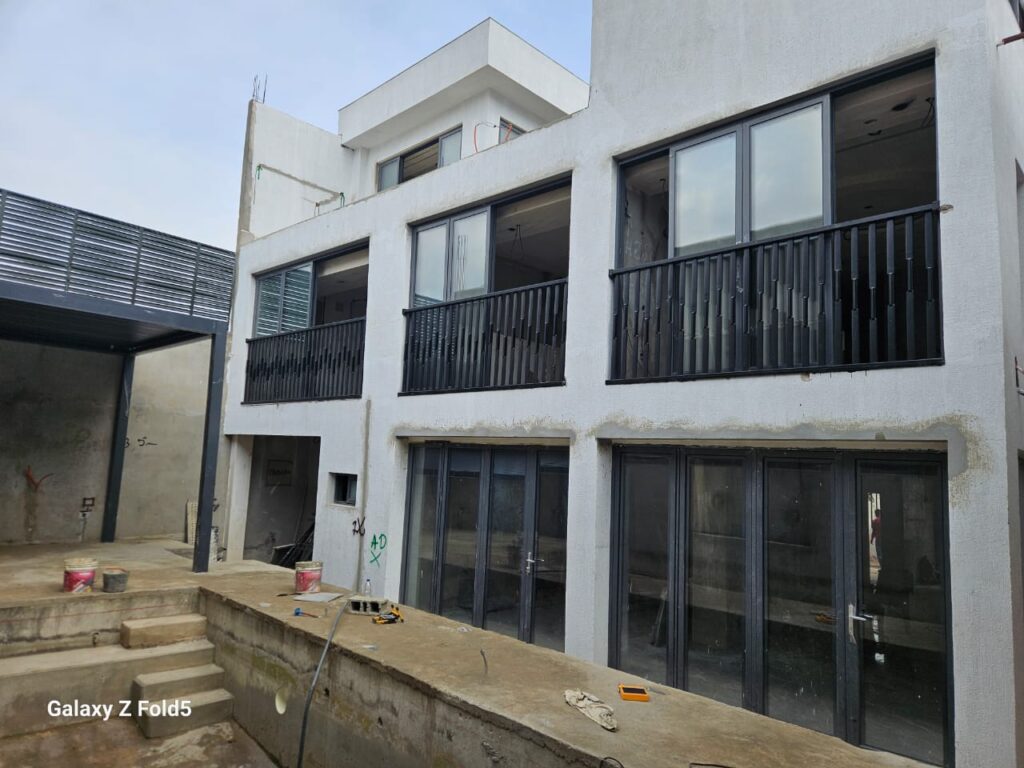 Côte d'Ivoire client show the door they installed