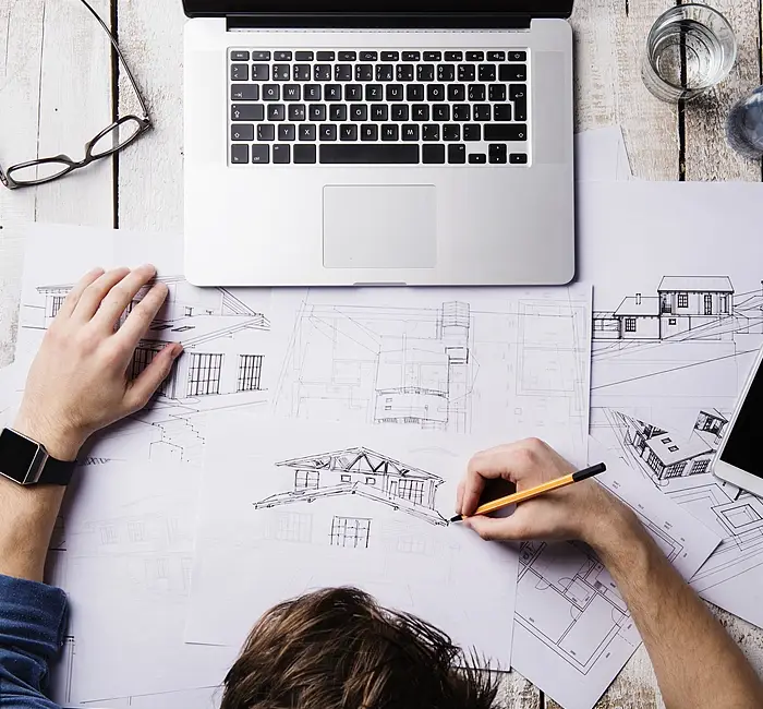 Designer draw the building details for his clients