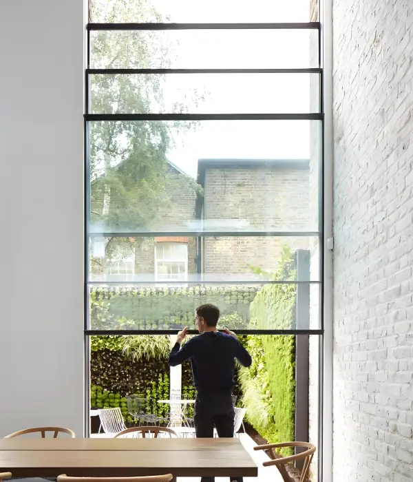 Slim-frame sliding window with narrow aluminum sightlines