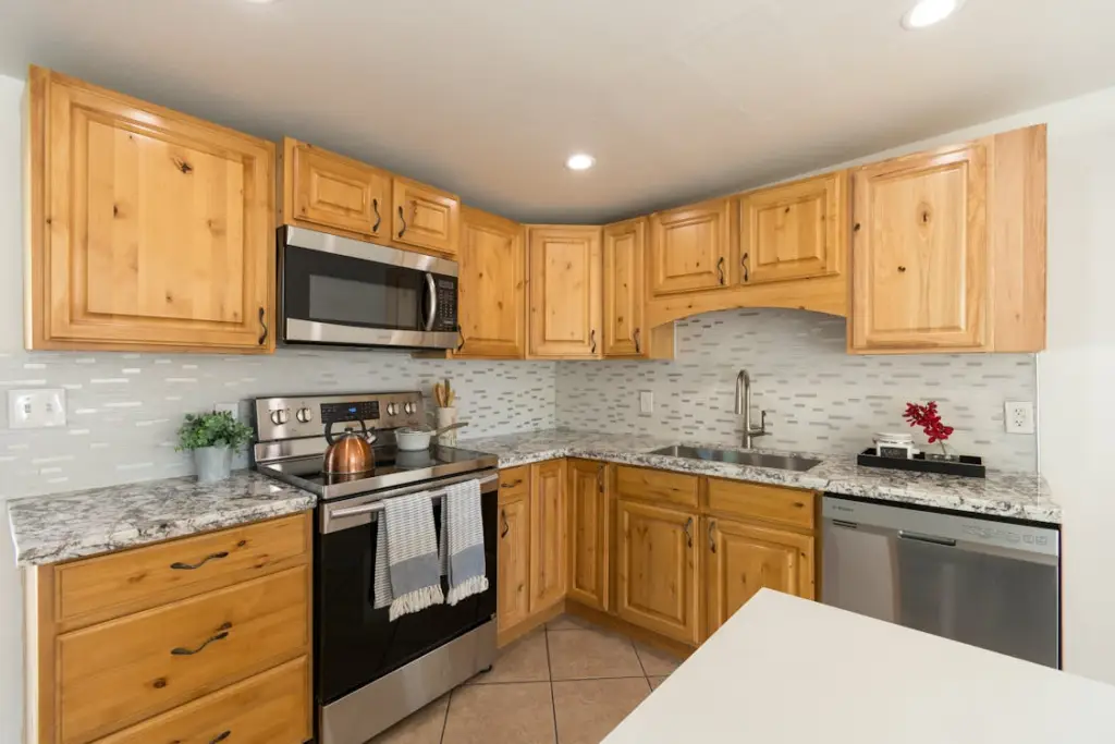 Knotty alder cabinet doors showing approved knot and color variation range