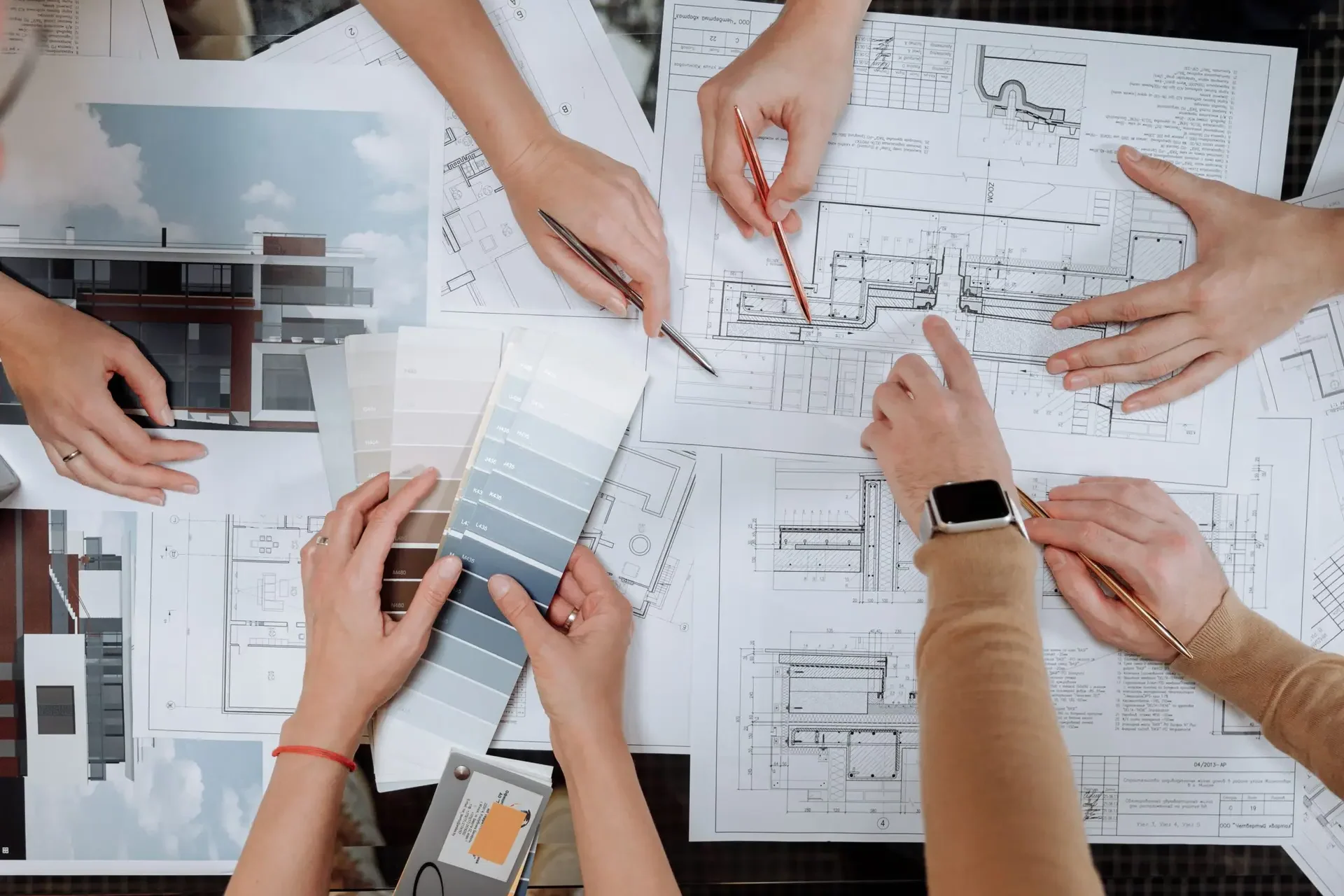 Building materials project coordinator reviewing drawings and finish samples